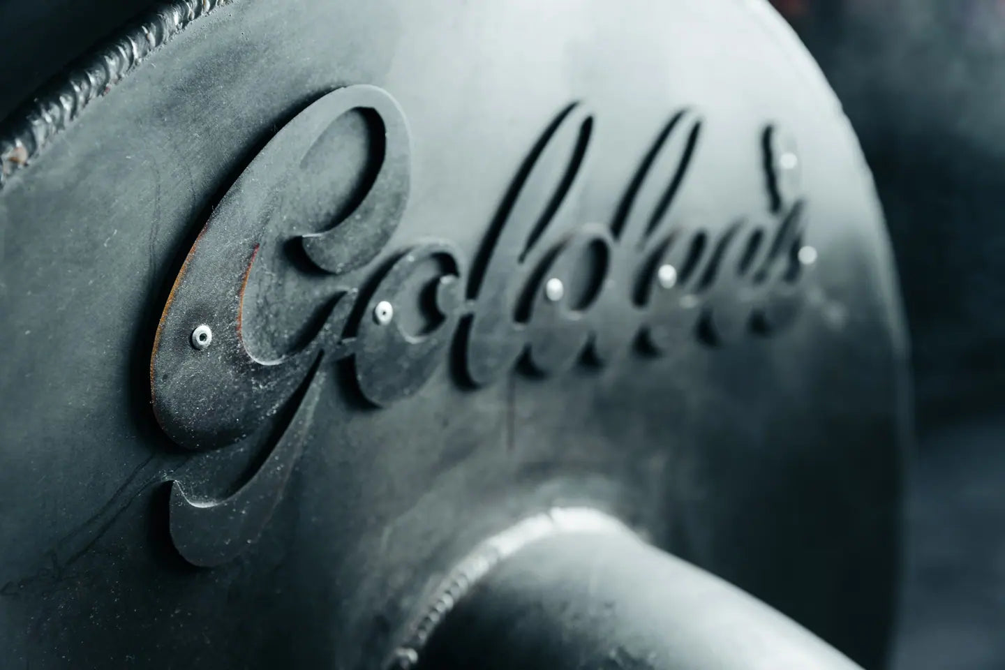 The Goldee's name cast into the door of an offset smoker