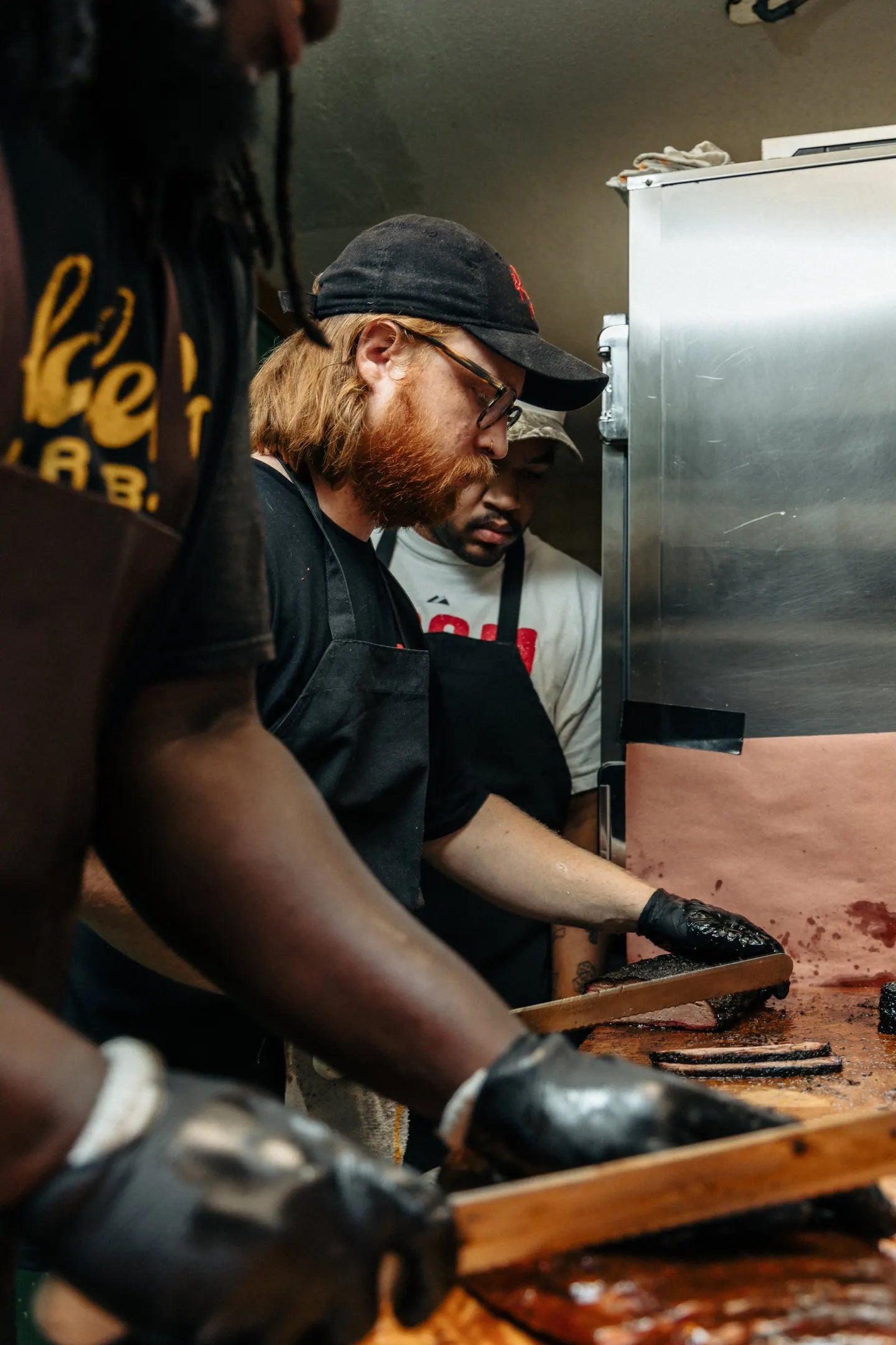 Goldee's crew working behind the counter